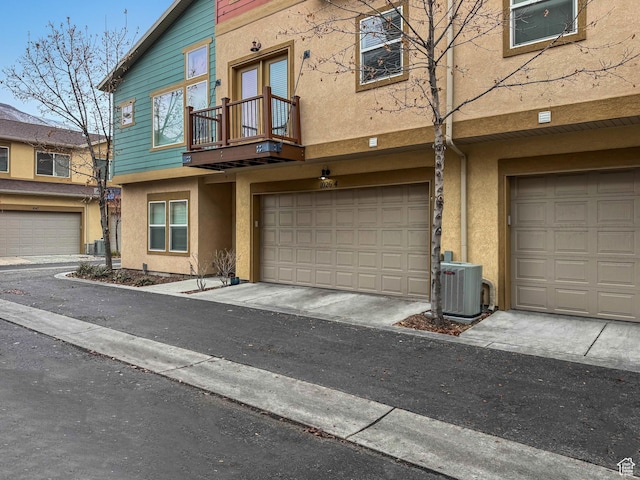 1026 N Shepard Creek Pkwy Unit 4, Farmington, UT 84025 - townhome / multi-family property with a balcony, cooling unit, and a garage