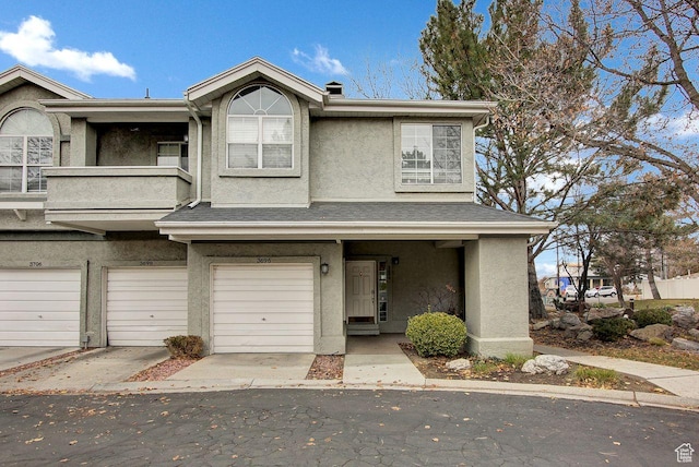 multi unit property featuring a garage