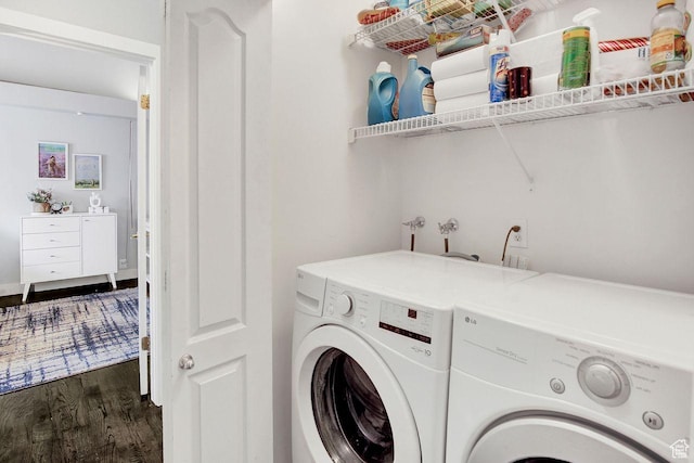 laundry area with separate washer and dryer and dark hardwood / wood-style floors