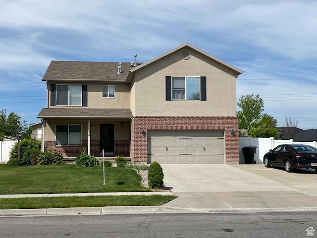454 S Lincolnshire W, Kaysville, UT 84037 - view of front facade featuring a front yard and a garage