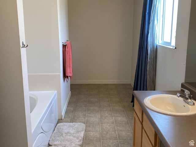 454 S Lincolnshire W, Kaysville, UT 84037 - bathroom with tile patterned floors, vanity, and a tub to relax in