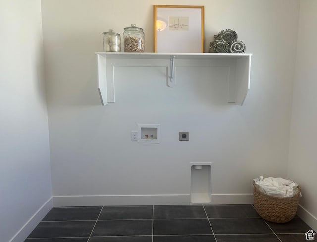 laundry room with dark tile patterned floors, washer hookup, and hookup for an electric dryer