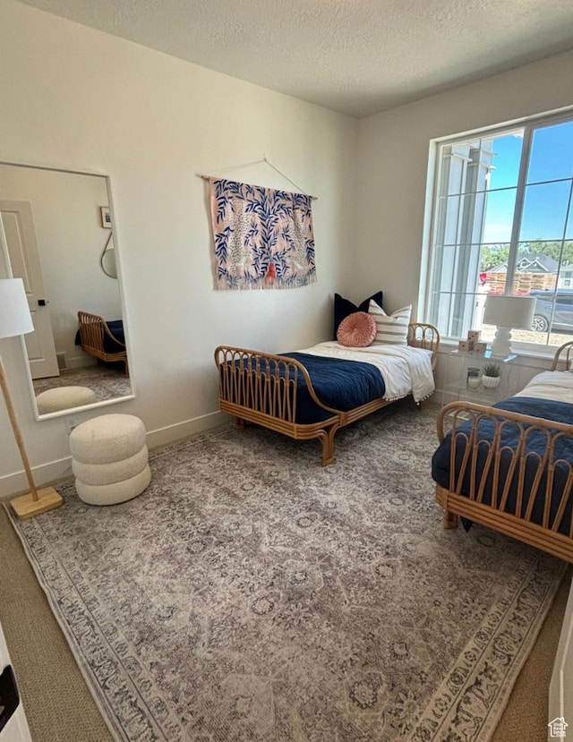 bedroom featuring a textured ceiling