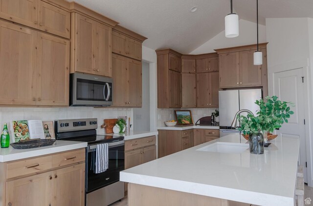 288 E 1150 N Unit 80, Salem, UT 84653 - kitchen featuring stainless steel appliances, lofted ceiling, backsplash, and an island with sink