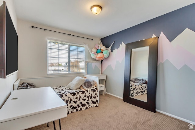 carpeted bedroom featuring baseboards