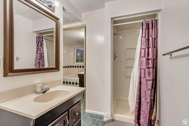 full bathroom featuring a stall shower, tile patterned flooring, and vanity