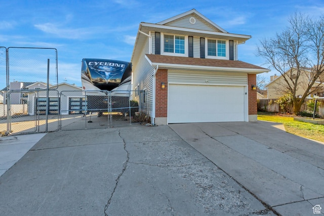 view of front of property featuring concrete driveway, a garage, a gate, and fence