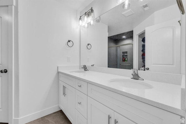 13963 S Wide Ridge Way Unit 1121, Herriman, UT 84096 - bathroom with tile patterned flooring, vanity, and an enclosed shower