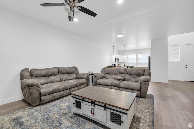 13963 S Wide Ridge Way Unit 1121, Herriman, UT 84096 - living room with light hardwood / wood-style floors and ceiling fan