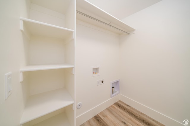 laundry area featuring hardwood / wood-style floors, hookup for an electric dryer, and hookup for a washing machine