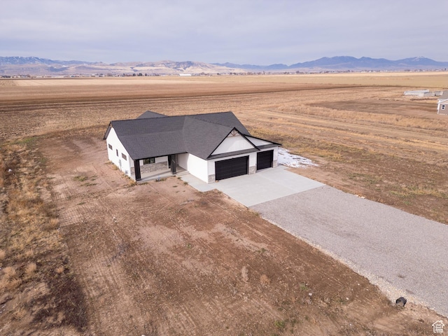 bird's eye view featuring a mountain view and a rural view