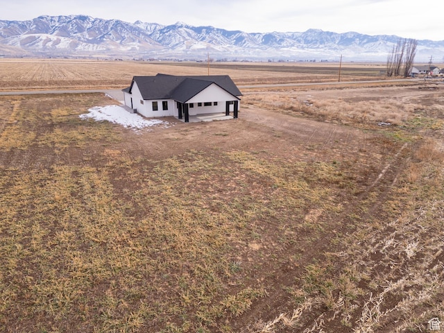 aerial view with a mountain view and a rural view