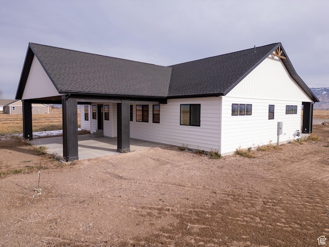 rear view of house featuring a patio area
