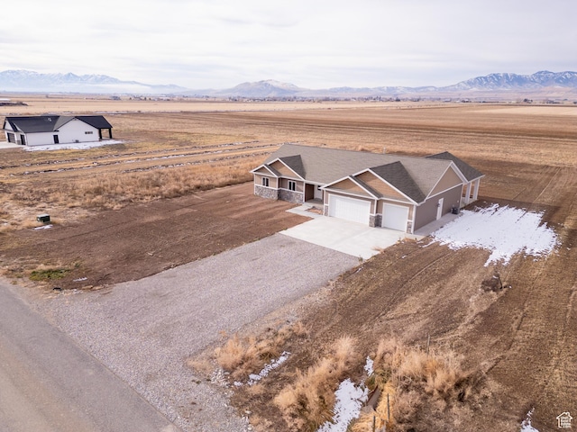 birds eye view of property featuring a mountain view and a rural view