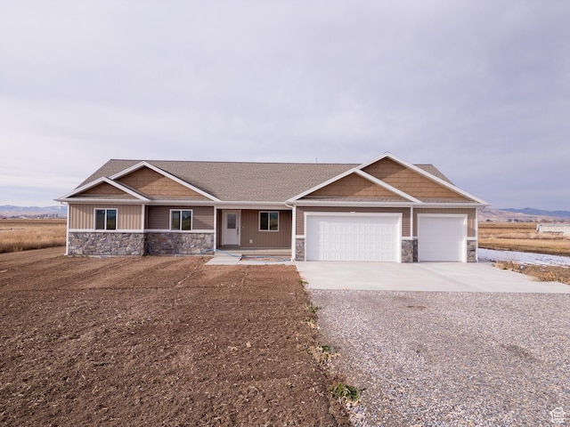 view of front of home featuring covered porch and a garage