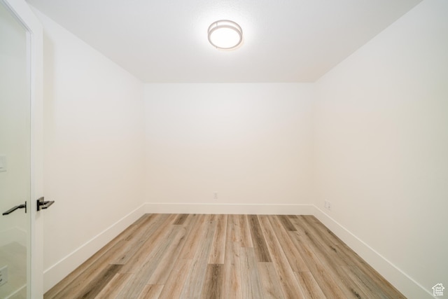 spare room with light hardwood / wood-style flooring
