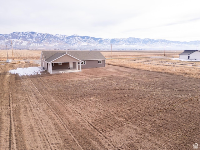 exterior space with a mountain view and a rural view