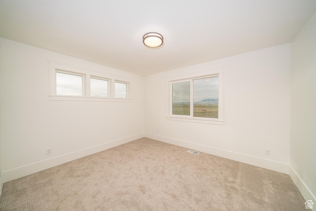spare room featuring carpet flooring