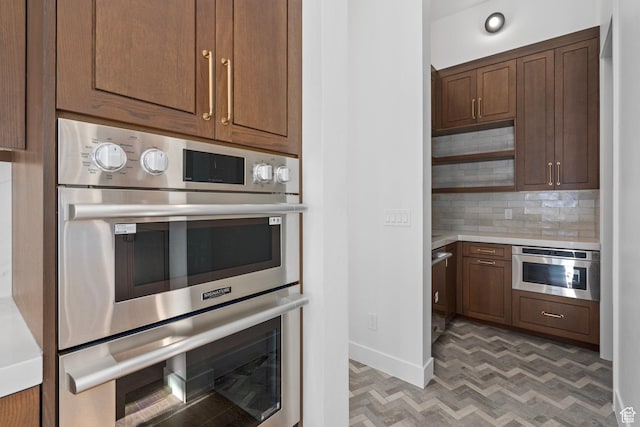 3050 Country Crossings, Heber City, UT 84032 - kitchen with stainless steel appliances, light countertops, backsplash, and open shelves