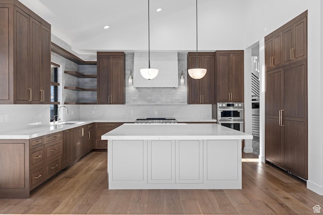 3050 Country Crossings, Heber City, UT 84032 - kitchen with open shelves, wood finished floors, a center island, tasteful backsplash, and light countertops