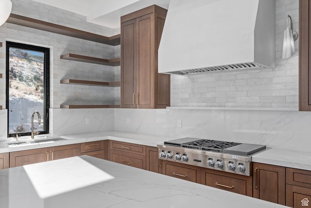 3050 Country Crossings, Heber City, UT 84032 - kitchen featuring custom exhaust hood, open shelves, stainless steel gas cooktop, light stone counters, and tasteful backsplash