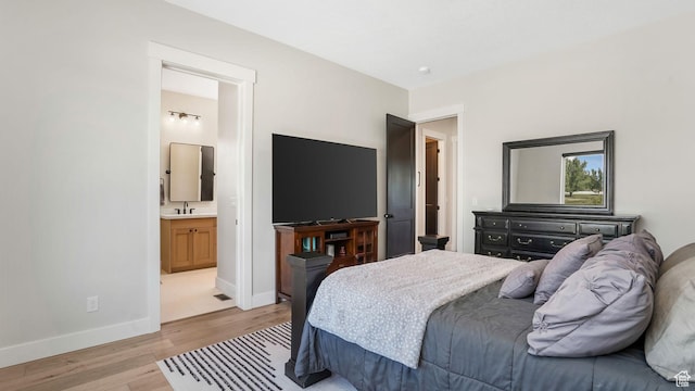 928 N Foxhunter Dr W, Farmington, UT 84025 - bedroom featuring light wood-type flooring, a sink, baseboards, and ensuite bathroom