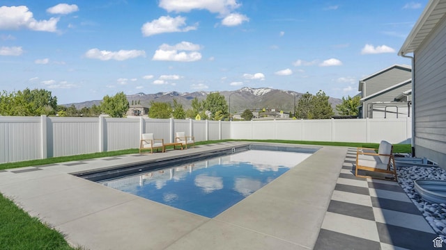 928 N Foxhunter Dr W, Farmington, UT 84025 - view of pool with a mountain view, a fenced backyard, and a patio