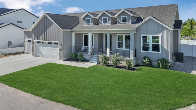 928 N Foxhunter Dr W, Farmington, UT 84025 - view of front of property with board and batten siding, covered porch, central air condition unit, a shingled roof, and concrete driveway