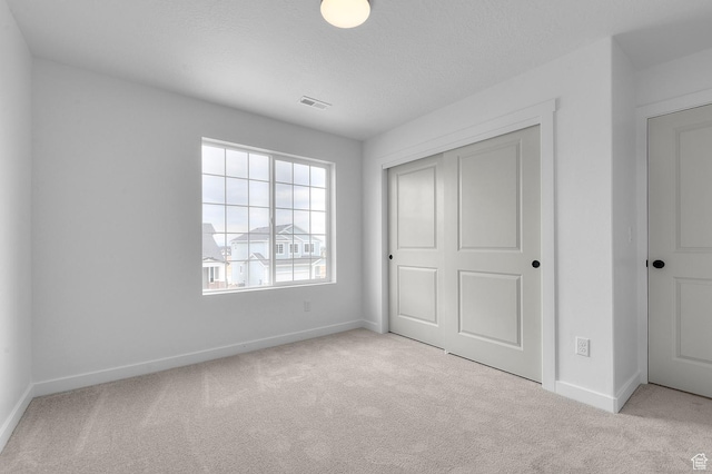 6627 W Spring Snow Ln, Herriman, UT 84096 - unfurnished bedroom with carpet floors, baseboards, and a closet