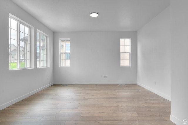 6627 W Spring Snow Ln, Herriman, UT 84096 - unfurnished room featuring light wood finished floors and baseboards