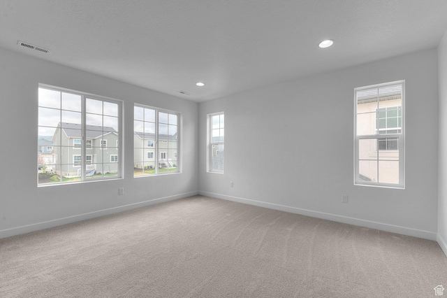 6627 W Spring Snow Ln, Herriman, UT 84096 - unfurnished room with baseboards, light colored carpet, and recessed lighting