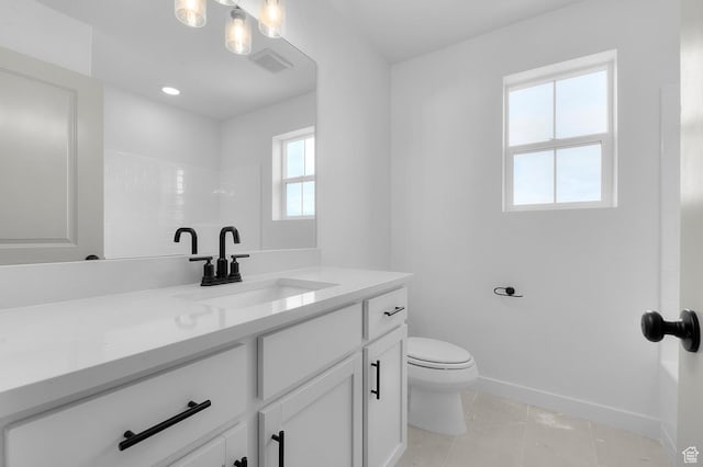 6627 W Spring Snow Ln, Herriman, UT 84096 - full bath featuring vanity, tile patterned floors, toilet, baseboards, and a shower
