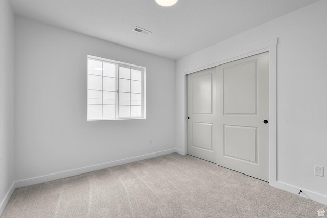 6627 W Spring Snow Ln, Herriman, UT 84096 - unfurnished bedroom with carpet, baseboards, and a closet