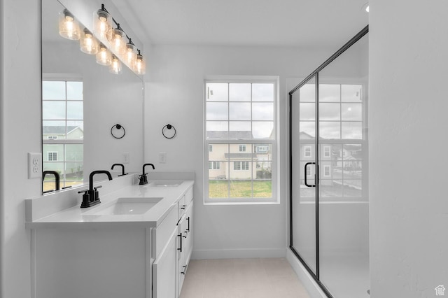 6627 W Spring Snow Ln, Herriman, UT 84096 - full bath featuring double vanity, baseboards, and a stall shower