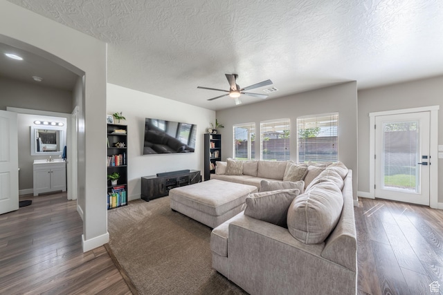 3459 S 2960 E, St George, UT 84790 - living area with arched walkways, visible vents, a ceiling fan, and hardwood / wood-style flooring