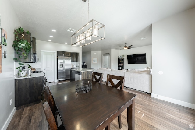 3459 S 2960 E, St George, UT 84790 - dining room featuring wood finished floors, visible vents, baseboards, and ceiling fan