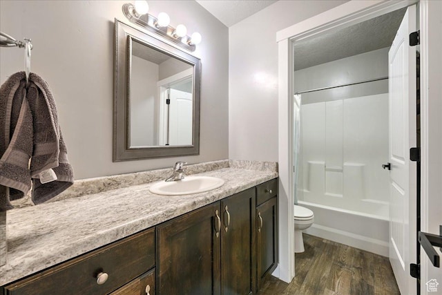 3459 S 2960 E, St George, UT 84790 - bathroom with washtub / shower combination, wood finished floors, toilet, and vanity