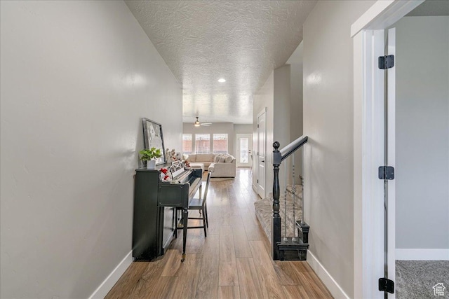 3459 S 2960 E, St George, UT 84790 - hall featuring wood finished floors, baseboards, and a textured ceiling