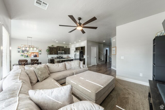 3459 S 2960 E, St George, UT 84790 - living room with stairway, ceiling fan, baseboards, visible vents, and recessed lighting