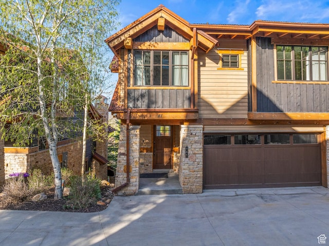 41 E Silver Star Ct Unit C-19, Park City, UT 84060 - view of front of property with a garage, concrete driveway, and stone siding