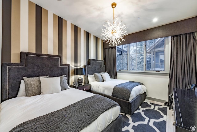 41 E Silver Star Ct Unit C-19, Park City, UT 84060 - carpeted bedroom featuring a chandelier, baseboards, and wallpapered walls
