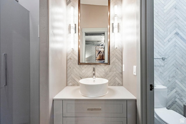 41 E Silver Star Ct Unit C-19, Park City, UT 84060 - bathroom with vanity, tasteful backsplash, and toilet