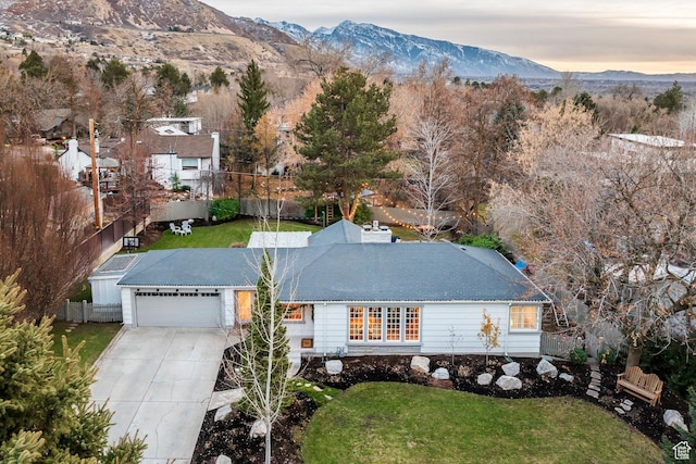 2760 E Spring Creek Rd, Holladay, UT 84117 - aerial view at dusk featuring a mountain view