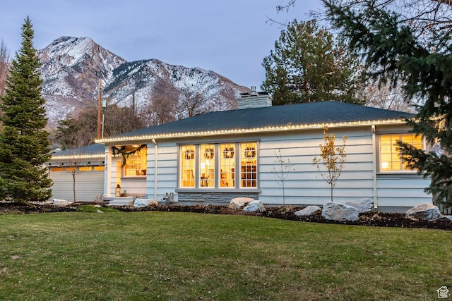 2760 E Spring Creek Rd, Holladay, UT 84117 - view of front of home with a mountain view, a garage, and a front lawn
