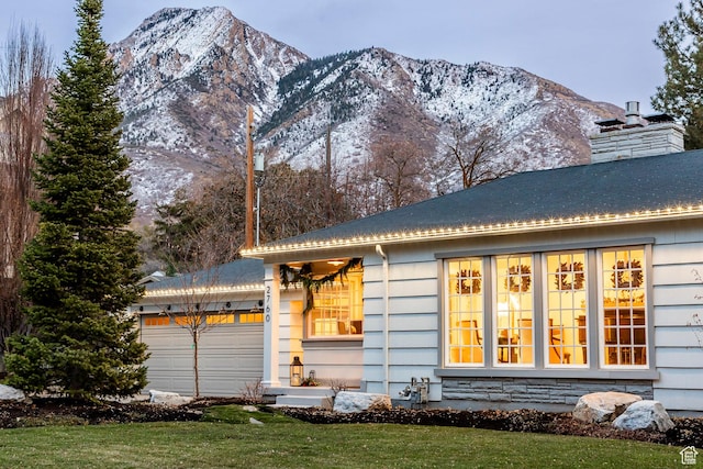 2760 E Spring Creek Rd, Holladay, UT 84117 - view of front of house featuring a mountain view, a garage, and a front lawn