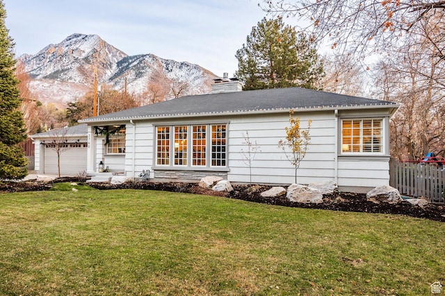 2760 E Spring Creek Rd, Holladay, UT 84117 - view of front facade with a mountain view, a front yard, and a garage