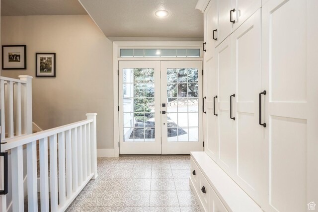 2760 E Spring Creek Rd, Holladay, UT 84117 - mudroom featuring light tile patterned floors and french doors