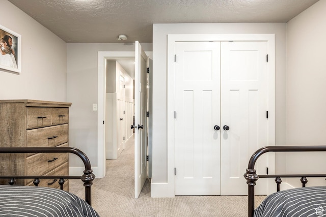 2760 E Spring Creek Rd, Holladay, UT 84117 - bedroom with a textured ceiling, a closet, and light carpet