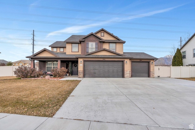 craftsman-style house with a front yard and a garage