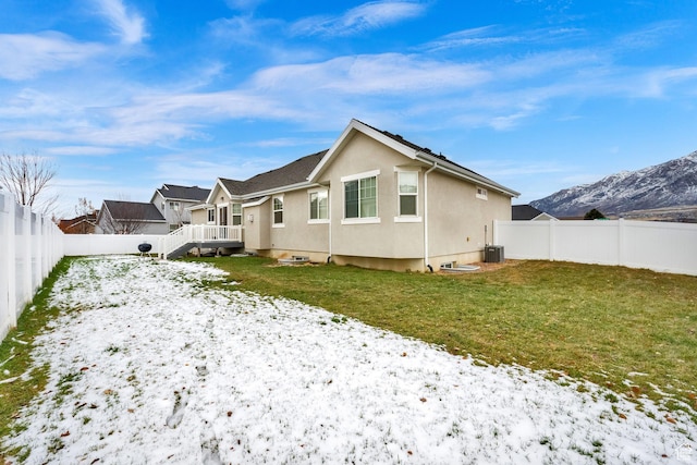143 E 1825 N, North Ogden, UT 84414 - snow covered house featuring a mountain view, a yard, a fenced backyard, and stucco siding